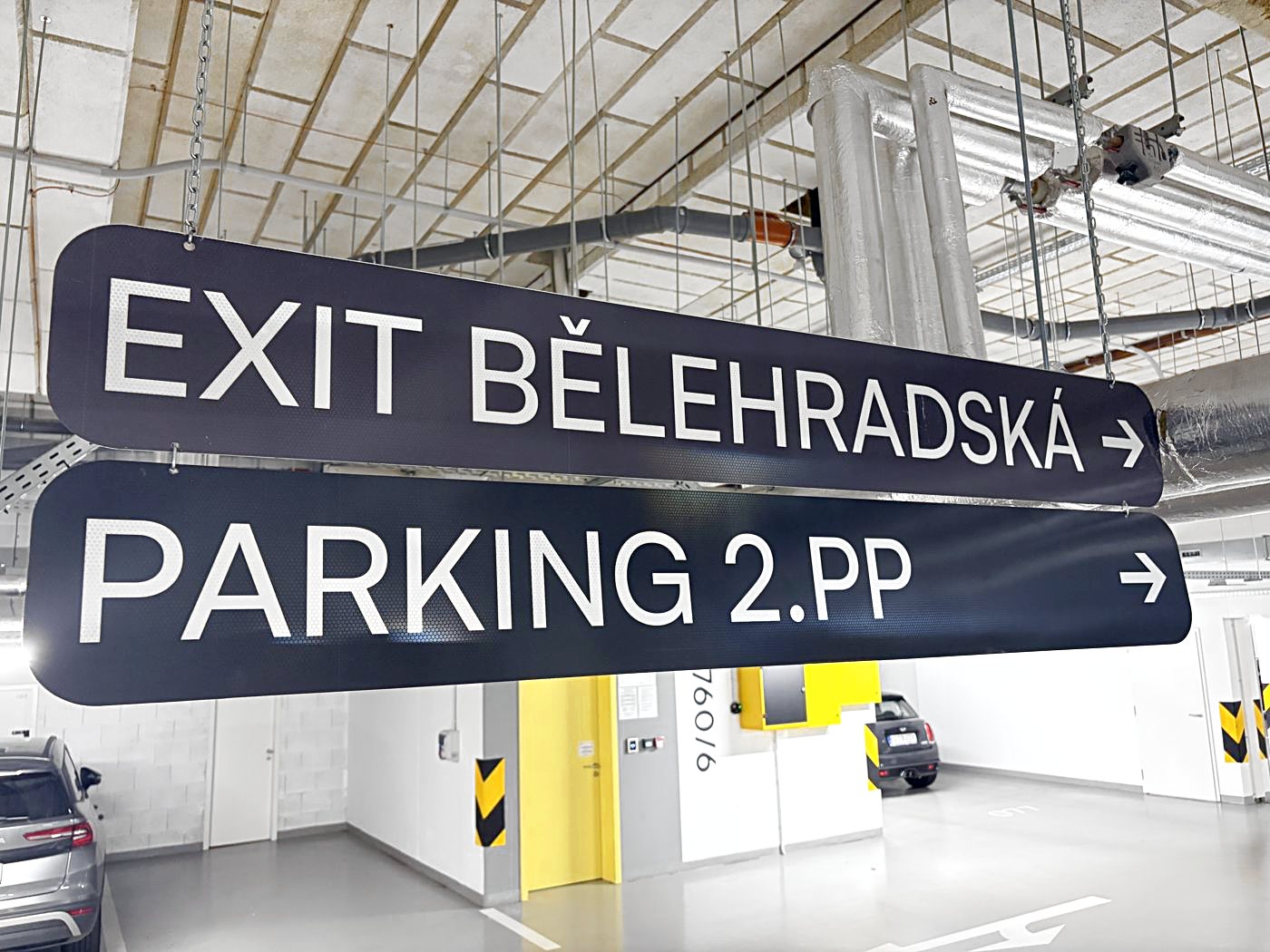 The ramp takes you down to level −1. Follow the PARKING 2.PP signs to the next r