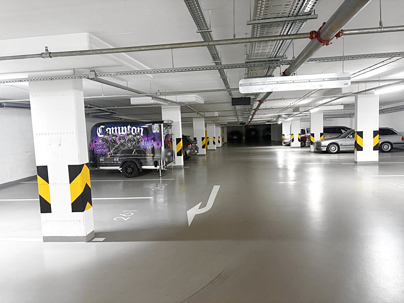 At the bottom of the ramp on level −2 turn left twice straight away and look for